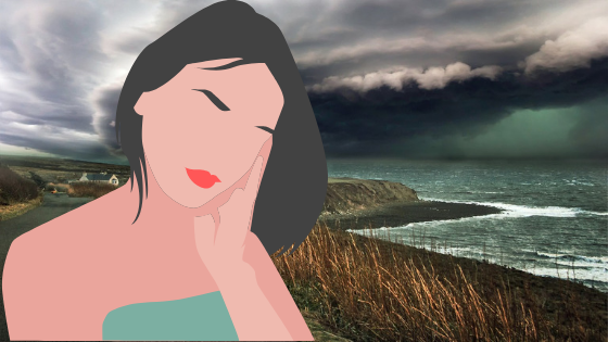 morskie wybrzerze i zastanawiająca się kobieta